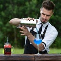 Catering bar service, bartender workplace. Handsome caucasian ba