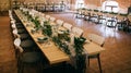 Catering. Beautiful table decoration in a restaurant with green leaves and candles