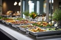 Catering buffet food on a long table in a hotel restaurant