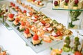 Catering. Off-site food. Buffet table with various canapes, sandwiches, hamburgers and snacks Royalty Free Stock Photo