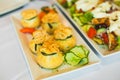 Catering plate. Top view of white porcelain dish on table with cold appetizers in restaurant, cafe. Royalty Free Stock Photo