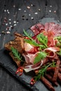 Catering platter with different meat products sliced ham, sausage, prosciutto, bacon. Meat antipasto Royalty Free Stock Photo
