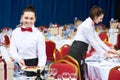 Catering restaurant waitress serving table with food Royalty Free Stock Photo