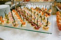 Catering - served table with various snacks, canape and appetizers