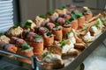 Catering service buffet plate with canapes and appetizing sandwiches