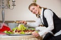 Catering service employee or waitress preparing a buffet Royalty Free Stock Photo