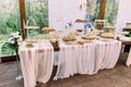 Catering services in restaurant. Wedding table reception on wedding ceremony in restaurant outdoors in the forest