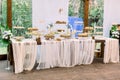 Catering services in restaurant. Wedding table reception on wedding ceremony in restaurant outdoors in the forest