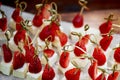 Catering for the wedding Banquet. Strawberry and cheese canap Royalty Free Stock Photo