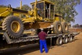 Caterpillar 140H Transporter - On Flatbed Trailer