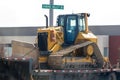 A Caterpillar Bull Dozer been transported on a trailer