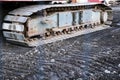 Caterpillar continuous tracks close up of digger on construction site Royalty Free Stock Photo