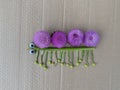 Caterpillar made of natural material, kids craft for playing on the street.