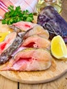 Catfish raw with lemon on board Royalty Free Stock Photo