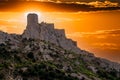 Cathar medieval fortress Queribus from the foot of the mountain in the summer. Languedoc, Occitania, France.