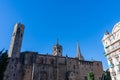 The Cathedral of Barcelona, detail of the side facade in typical gothic style, with an equestrian statue in the lower side.