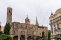 The Cathedral of Barcelona, detail of the side facade in typical gothic style, with an equestrian statue in the lower side.