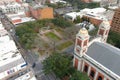 The Cathedral-Basilica of the Immaculate Conception surrounded by apartments, hotels, office buildings, lush green trees