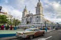 Classic car in front of Cathedral of Santiago de Cuba