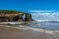 Cathedral beach iconic rocks with hole in Galicia