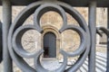 Cathedral door view through iron gate flower shape,historic cent
