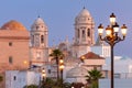 Cathedral of the Holy Cross on the Cadiz waterfront at dawn. Royalty Free Stock Photo