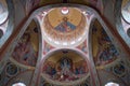 Cathedral interior with ceiling with religious paintings