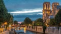 Cathedral Notre Dame de Paris day to night timelapse after sunset in Paris, France. Royalty Free Stock Photo