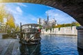 Cathedral of Notre Dame de Paris sunny autumn afternoon. Embankment of the Seine River. The natives and tourists take a walk and Royalty Free Stock Photo