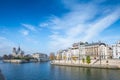 Cathedral of Notre Dame de Paris sunny autumn afternoon. Embankment of the Seine River. The natives and tourists take a walk and Royalty Free Stock Photo