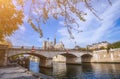 Cathedral of Notre Dame de Paris sunny autumn afternoon. Embankment of the Seine River. The natives and tourists take a walk and Royalty Free Stock Photo