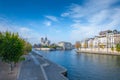 Cathedral of Notre Dame de Paris sunny autumn afternoon. Embankment of the Seine River. The natives and tourists take a walk and Royalty Free Stock Photo