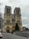 Cathedral of Notre Dame in Paris against the backdrop of a gray sky