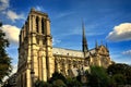 Cathedral of Notre-Dame in Paris feather clouds blue sky side view Royalty Free Stock Photo