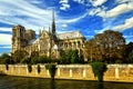 Cathedral of Notre-Dame in Paris feather clouds blue sky Royalty Free Stock Photo