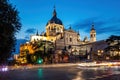Cathedral of Saint Mary the Royal of La Almudena in center of Madrid at night. View from the crossroad with car lights Royalty Free Stock Photo