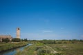 Cathedral of Santa Maria Assunta and bell tower by river on island of Torcello, Venice, Italy Royalty Free Stock Photo