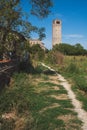 Cathedral of Santa Maria Assunta`s bell tower under blue sky on island of Torcello, Venice, Italy Royalty Free Stock Photo