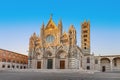 Cathedral in Siena Italy Tuscany, with White and Blue And Gray Striped Marble Round Window, Bell Tower, and Dome Royalty Free Stock Photo