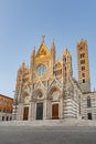 Cathedral in Siena Italy Tuscany, with White and Blue And Gray Striped Marble Round Window, Bell Tower, and Dome Royalty Free Stock Photo