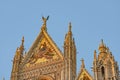 Cathedral in Siena Italy Tuscany, with White and Blue And Gray Striped Marble Round Window, Bell Tower, and Dome Royalty Free Stock Photo