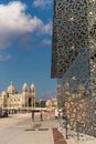 Cathedrale La Major at Marseille with blue sky and clouds and a modern structure to the right.