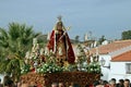 Catholic believers carrying the stature of the saint Catherine.