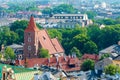 The Catholic brick church from above and the roofs of houses in