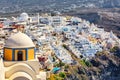 Catholic Cathedral of Saint John the Baptist with aerial view of Thira on Santorini island, Greece Royalty Free Stock Photo