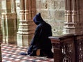 Catholic Christian Monk kneeling in humble prayer asking God for help Royalty Free Stock Photo