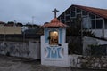 Catholic Christian shrine illuminated at dusk in Areia, Porto district, Portugal