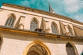 Catholic Church architecture . Church of St. Leonard in Austria on a bright blue sky background. Church building in Royalty Free Stock Photo