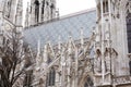 Catholic church. Baroque and Gothic architecture. Vaulted window with stained glass on facade of the building Royalty Free Stock Photo