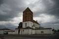 Catholic church in the city of Mir against the backdrop of a stormy sky. June. Evening. Stone building. Architecura. Story. Sight.